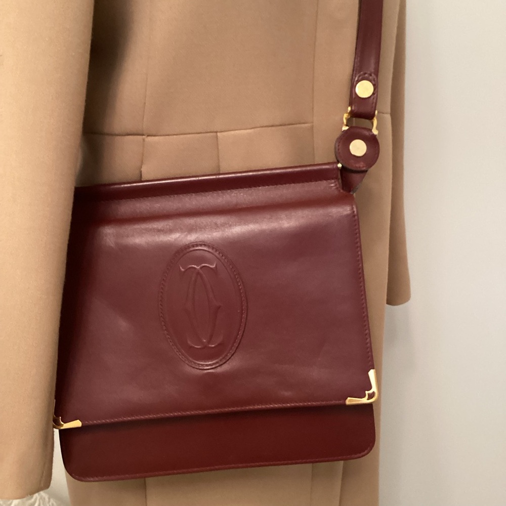 Authentic Cartier leather cross body bag.